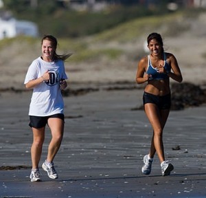 Girls_jog_along_Morro_Strand_State_Beach